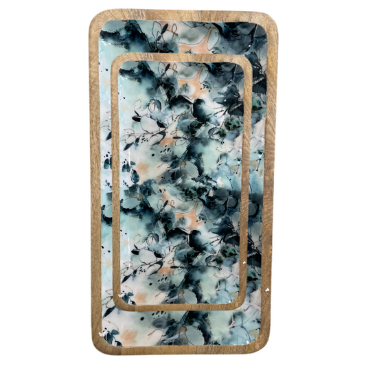 Platters in medium and large with a blue marble design made from sustainable mang wood. Food safe enamel coating