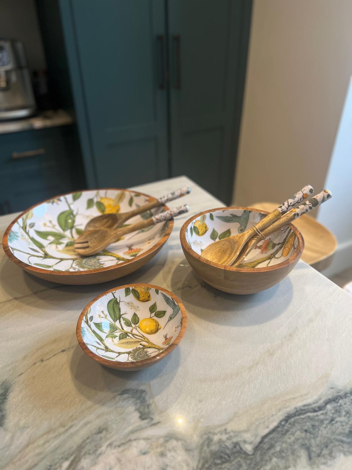 Set of bowls featuring a lemon bird design.  Suitable for summer dining.  Hand-made from sustainable mango wood