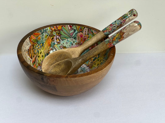 medium sized hand-painted wooden salad or fruit bowl in a multi-coloured floral pattern.  with matching salad spoons.  made from sustainable mango wood