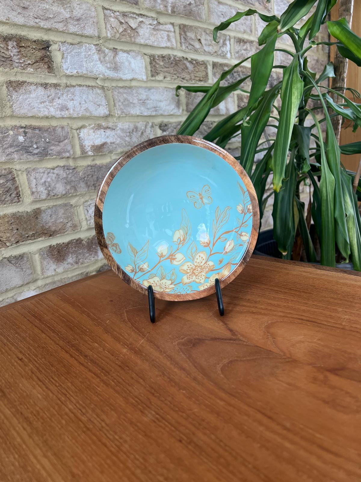 Small bowl (18cm diameter) with a decorated food safe enamel coating. Teal background and japanese style design incorporating magnolia and butterflies.  Matching salad spoon & fork with decorated handles.