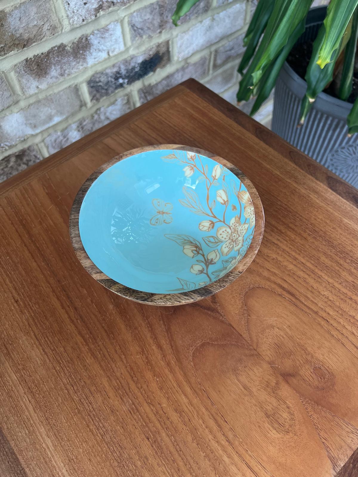 Small bowl (18cm diameter) with a decorated food safe enamel coating. Teal background and japanese style design incorporating magnolia and butterflies.  