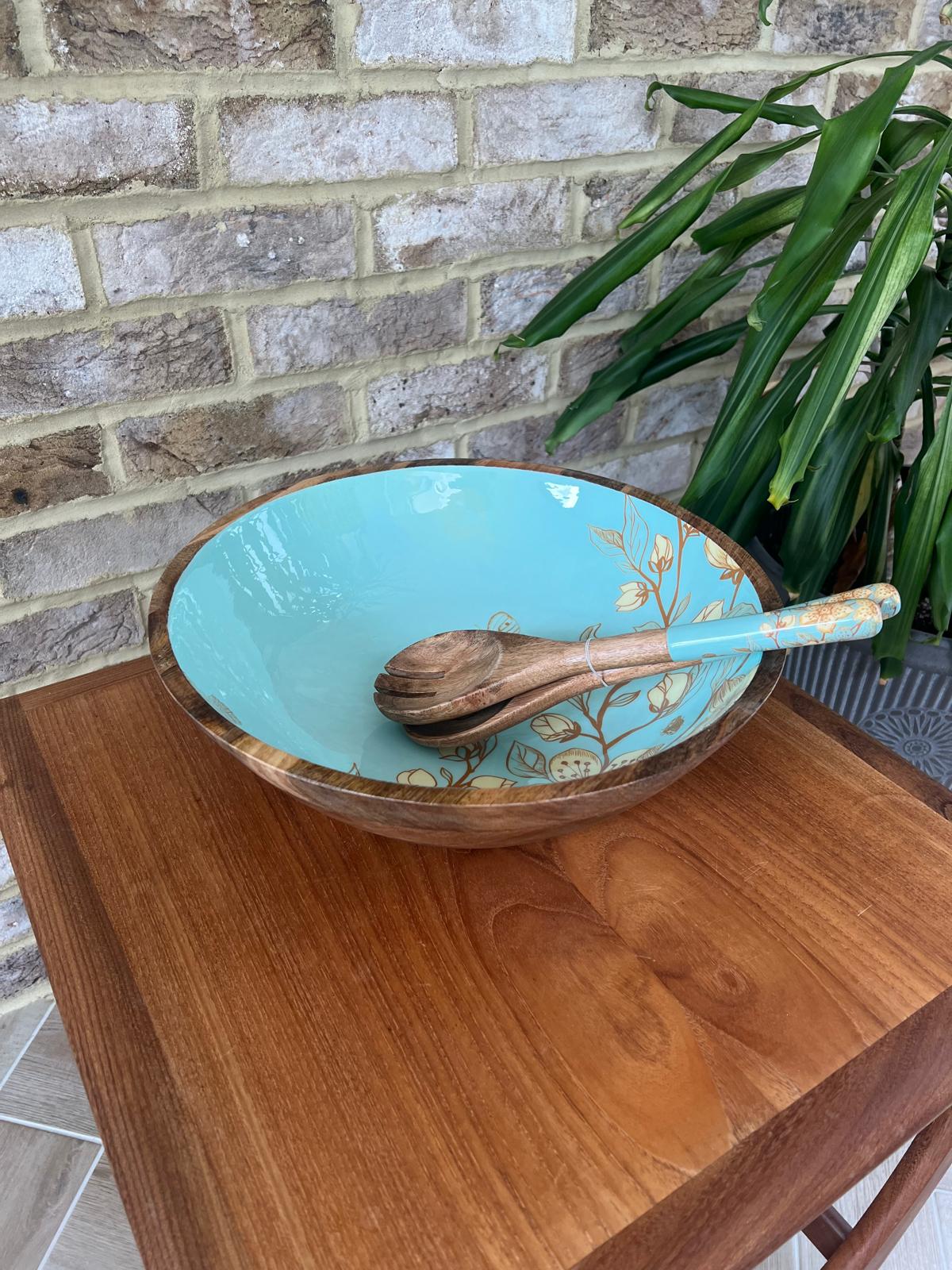 Large salad bowl (35cm diameter) with a decorated food safe enamel coating. Teal background and japanese style design incorporating magnolia and butterflies.  Matching salad spoon & fork with decorated handles.