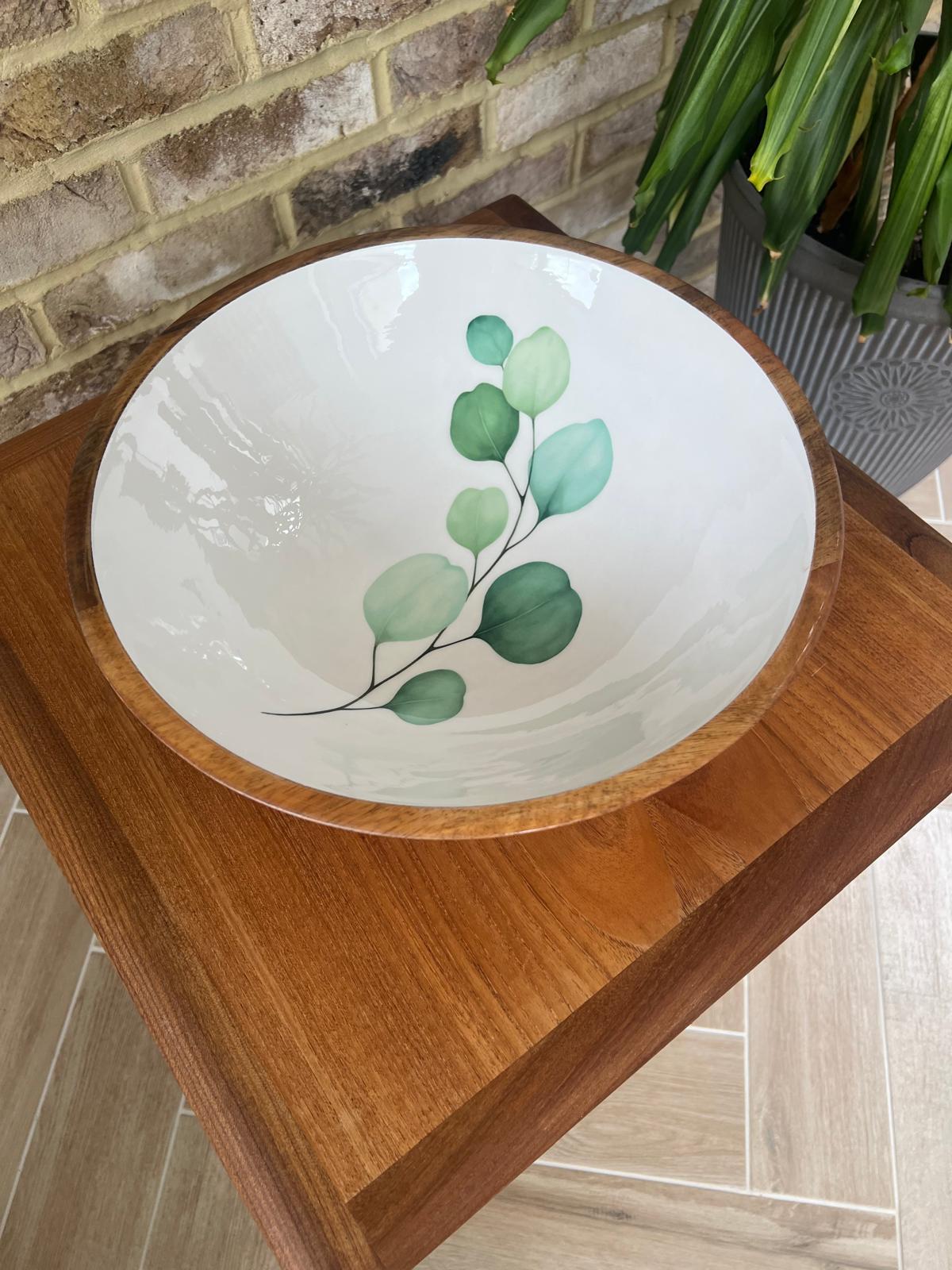 Round large sized bowl with green eucalyptus leaf design on a white background.  Suitable for cold and warm food.  Salad bowl. Bowl size 35cm diameter.  Made from sustainable mango wood.