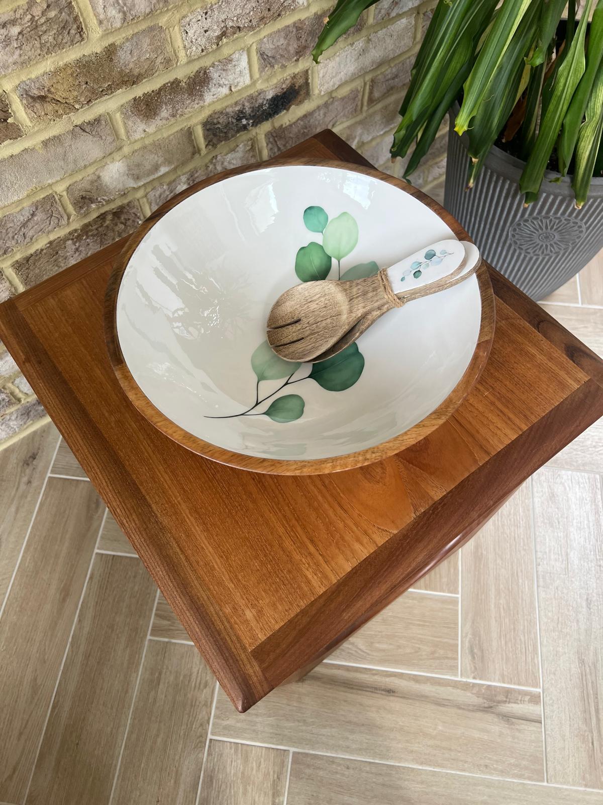 Round large sized bowl with green eucalyptus leaf design on a white background.  With matching salad spoon and fork.  Suitable for cold and warm food.  Salad bowl. Bowl size 35cm diameter.  Made from sustainable mango wood.