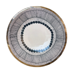 Round wooden bowl with decorative black and white abstract circles design on a white background