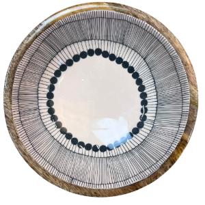 Round wooden bowl with decorative black and white abstract circles design on a white background