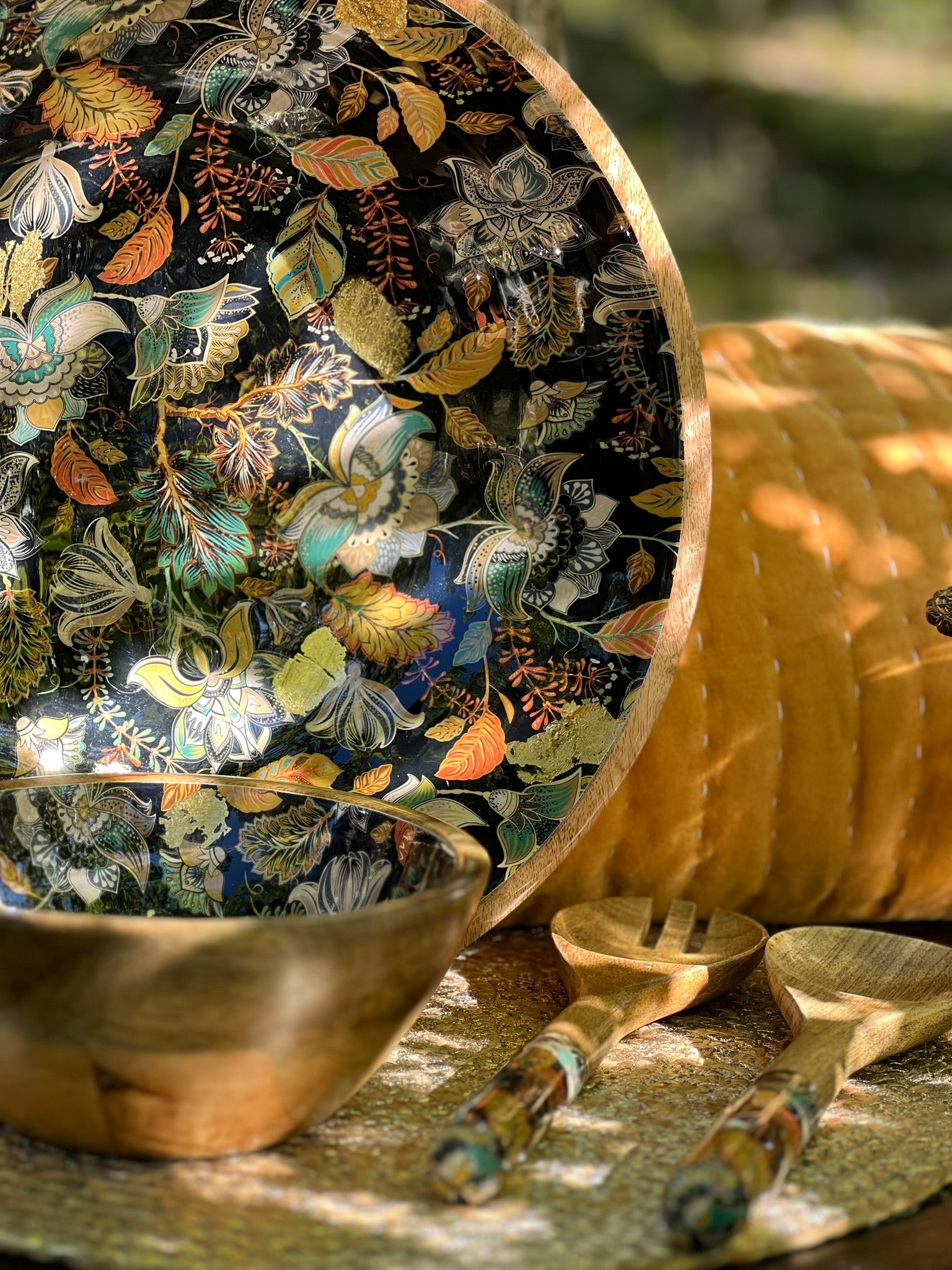 Large and medium bowl with Matching salad Servers with decorated handles. An elegant floral design in black features stunning accents of gold foil. Made from sustainable mango wood