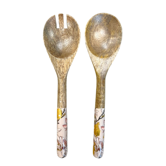 salad servers with decorated handles.  Designed to match magnolia design bowl