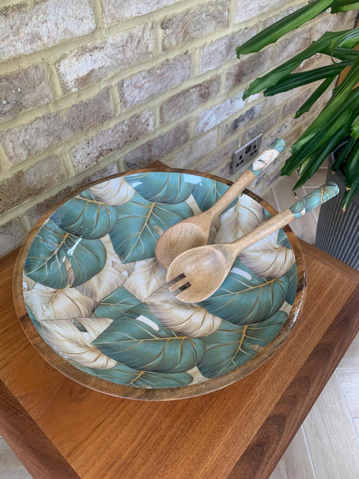 Large statement bowl with matching salad servers, Salad bowl. fruit bowl. This beautiful design features monstera (aka cheese plant) leaves in green & golden beige.  The ideal gift for anyone who loves house plants!!  Made from sustainable mango wood