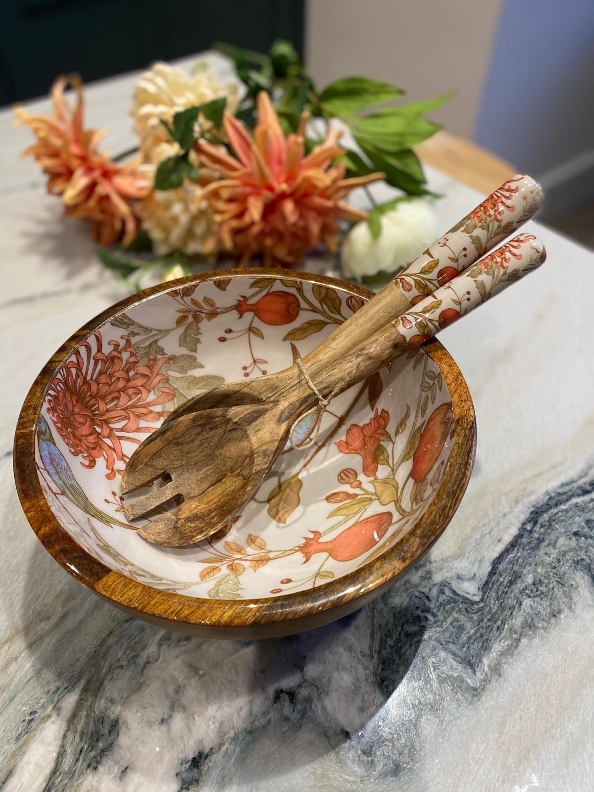 Medium bowl with matching salad servers.  Traditional william morris style design inspired by nature.  Orange and blue colours featuring birds and pomegranates. Made from sustainable mango wood.